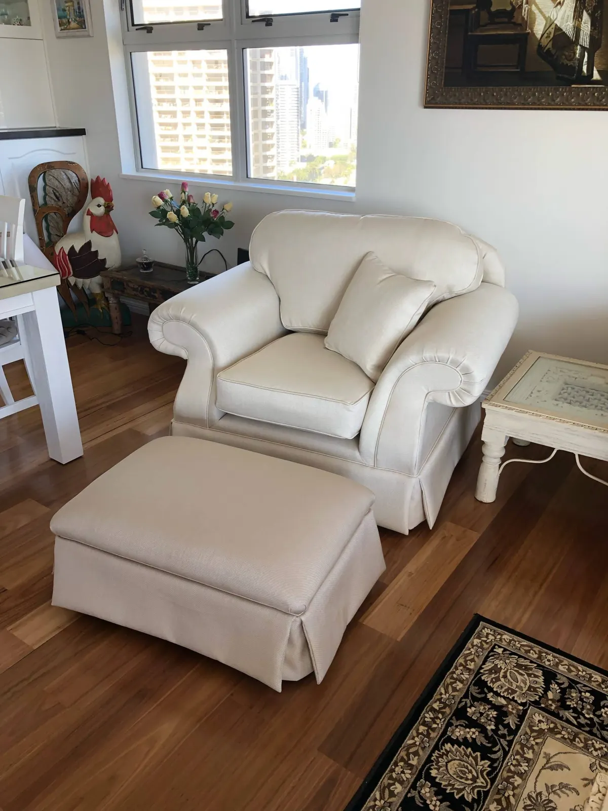 Reupholstered chair with ottoman