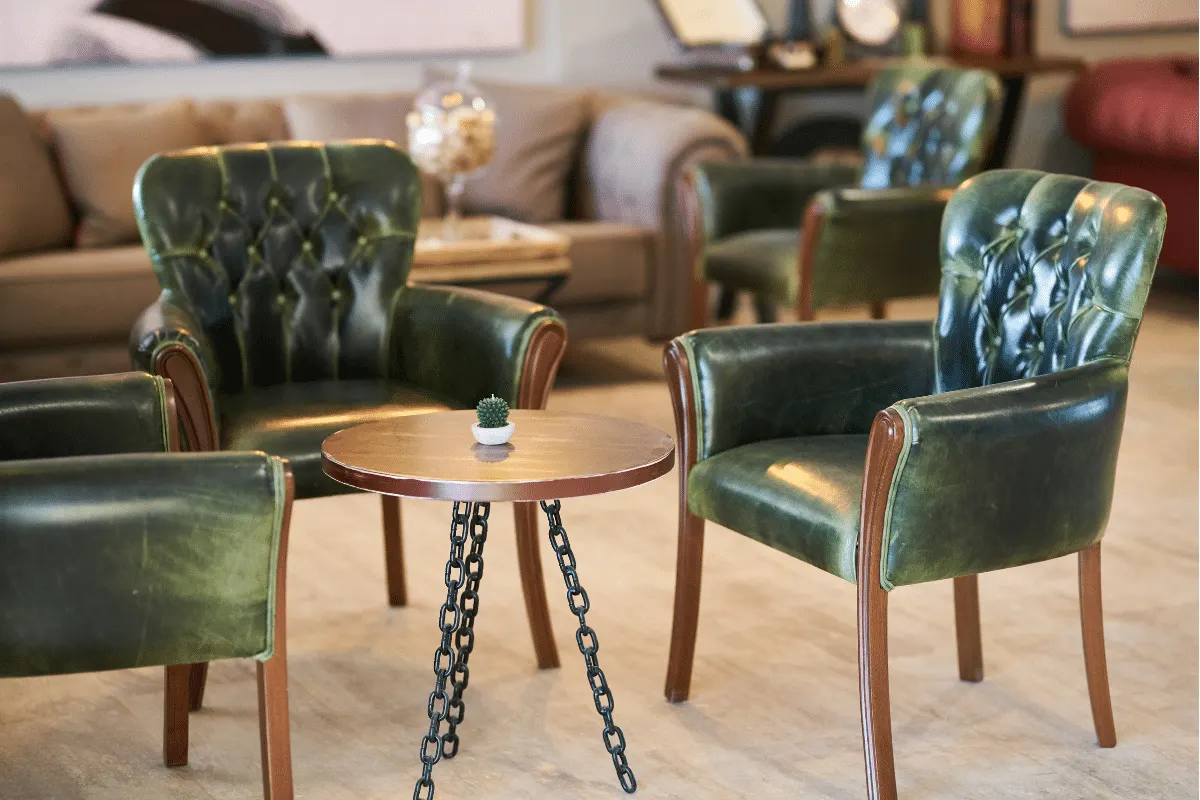 Reupholstered green leather chairs